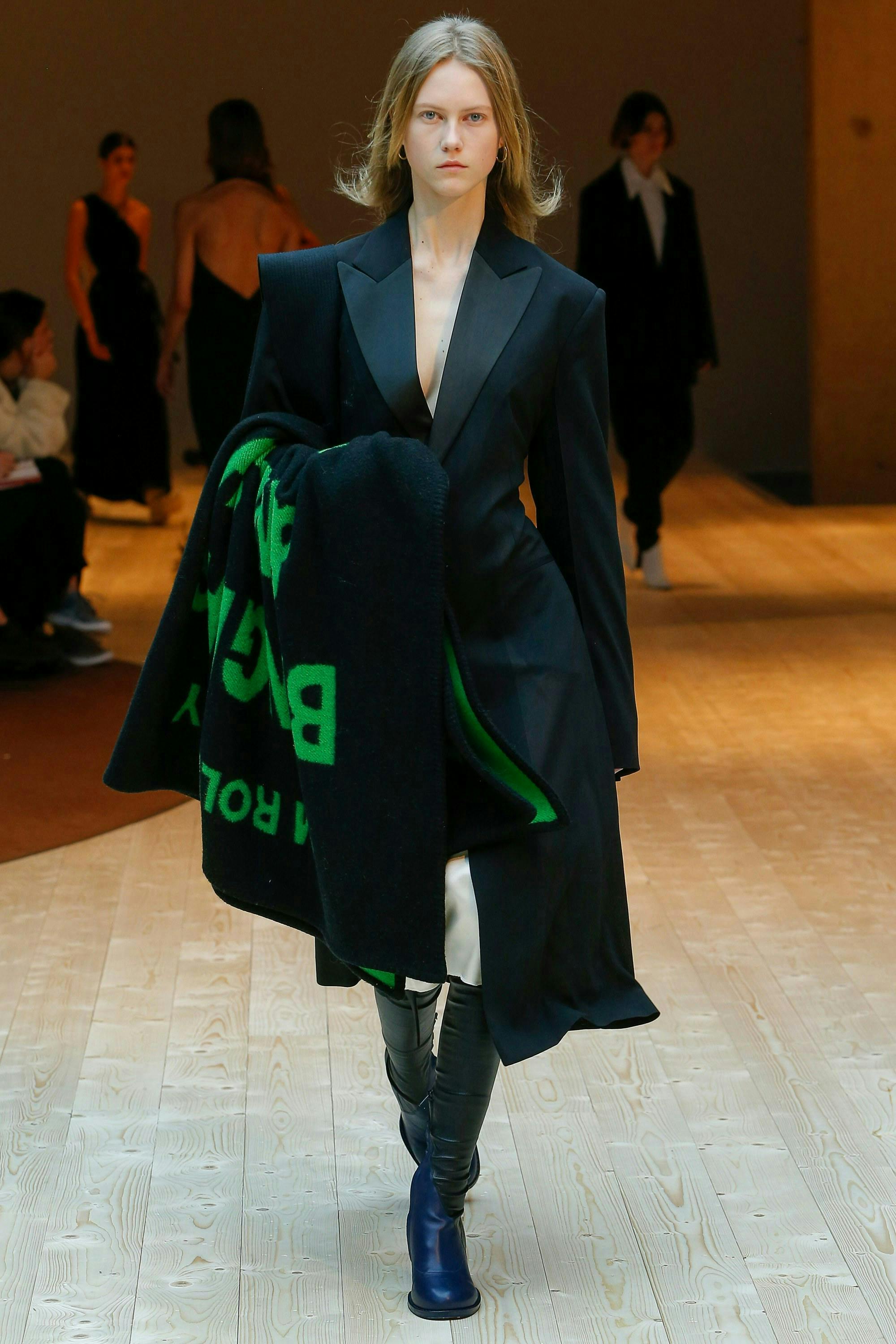 clothing apparel person human flooring coat long sleeve sleeve floor overcoat