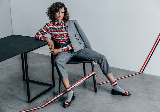 sitting person human clothing apparel shoe footwear furniture