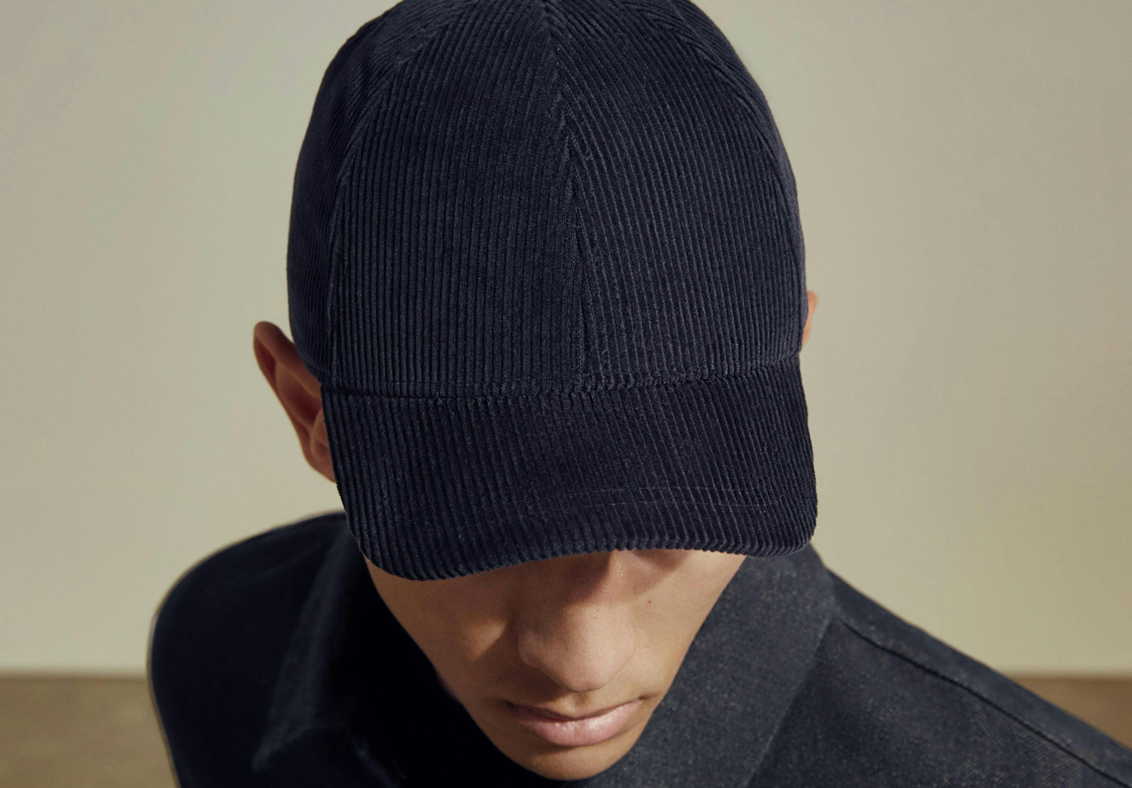 clothing apparel person human hat beanie cap
