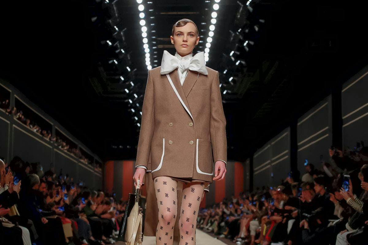 coat clothing apparel person human runway fashion