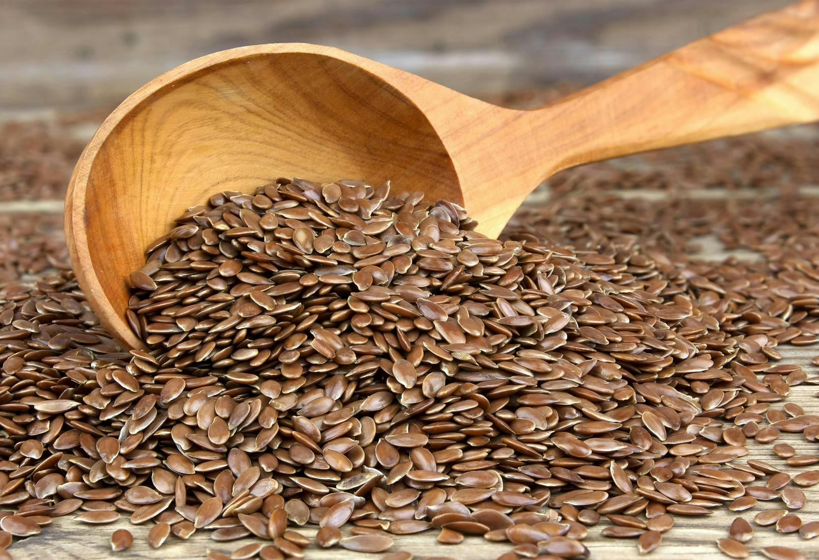 flax seed seeds wooden spoon flaxseed background food healthy brown health diet nutrition ingredient raw pile heap whole fatty linseed vintage group wooden spoon cutlery plant