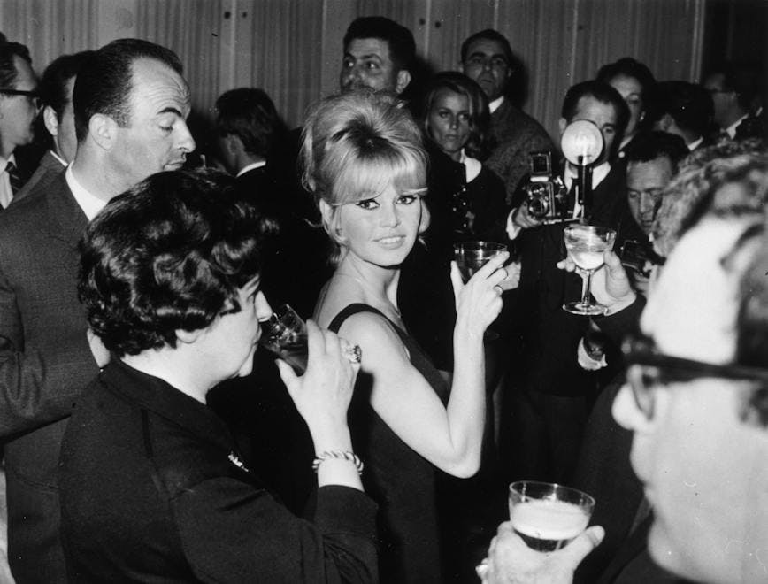 format landscape;black & white;male;female;glassware;drink;still person human party beverage drink alcohol sunglasses accessories pub bar counter